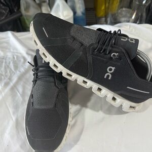 On Running Black and White Athletic Shoes with Cloud Technology